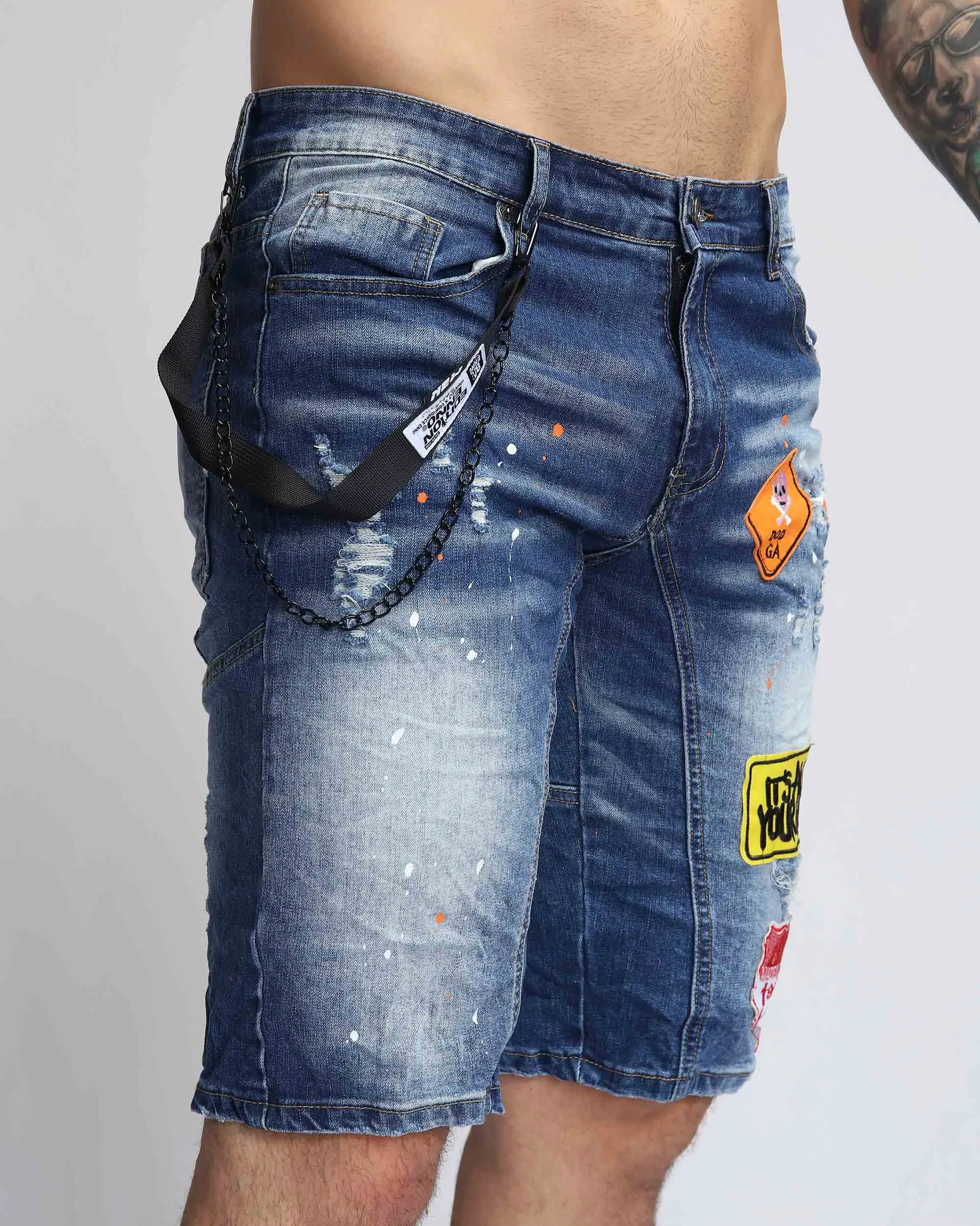 Ripped Blue Denim Shorts with Personality Badge in Medium Wash
