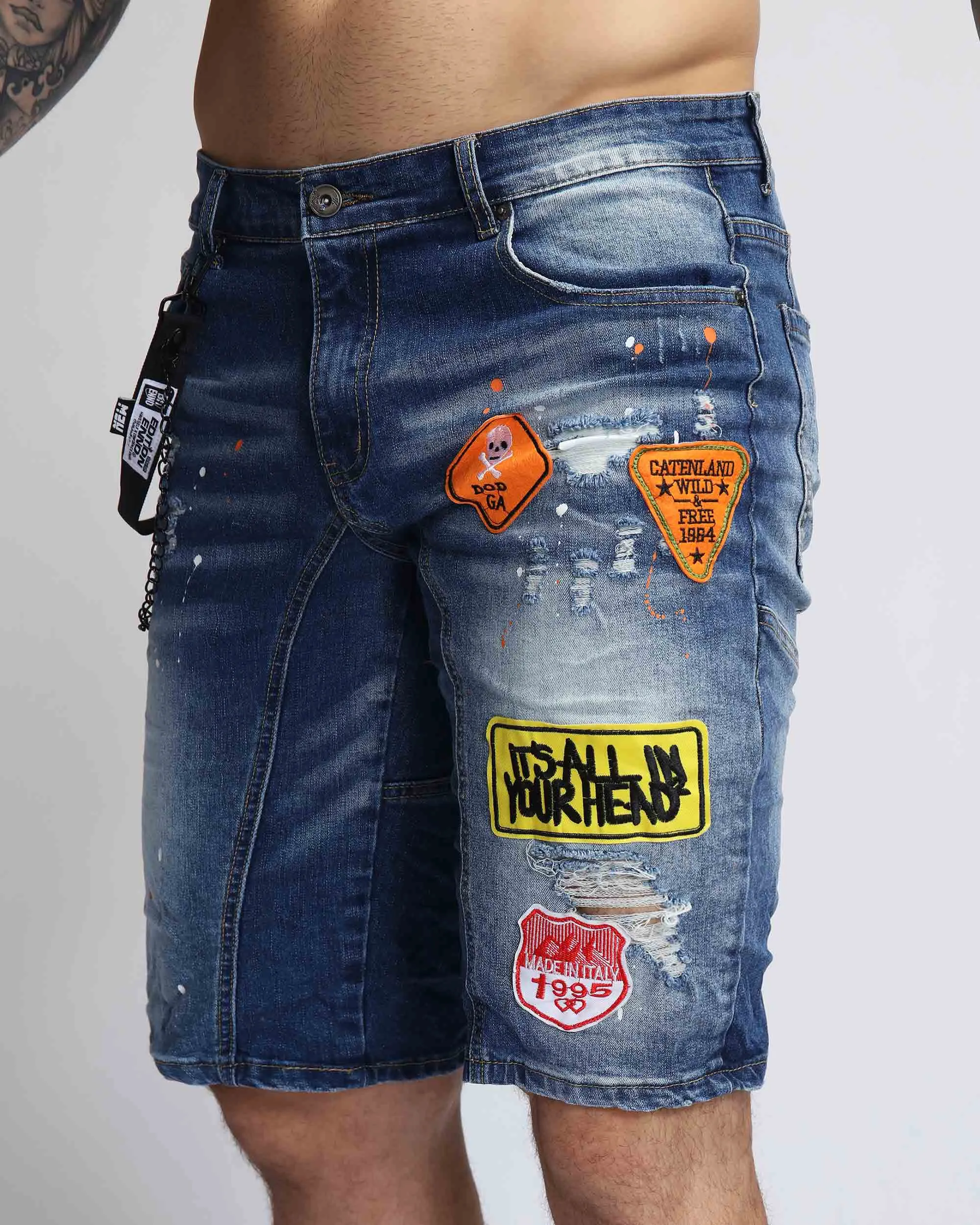 Ripped Blue Denim Shorts with Personality Badge in Medium Wash